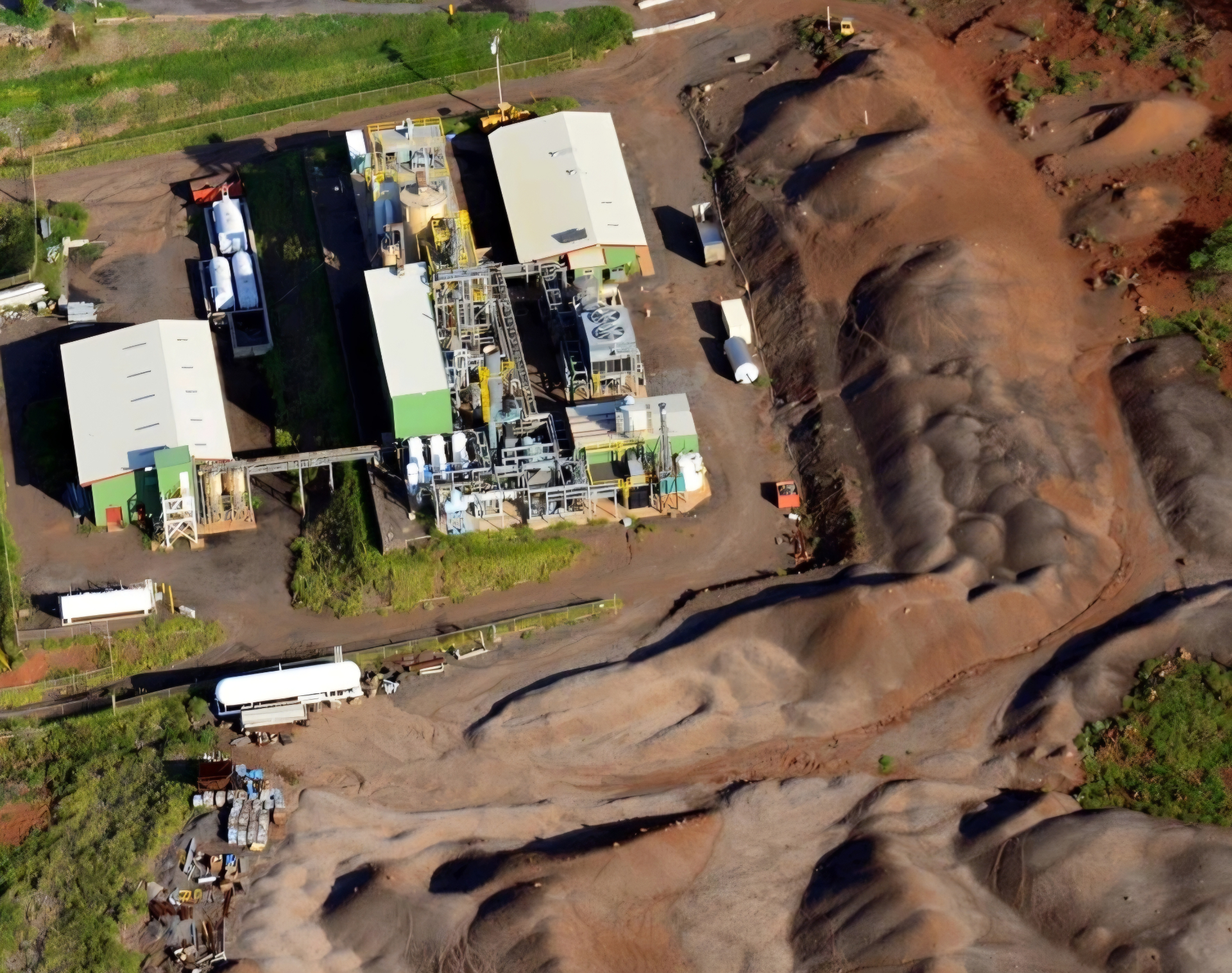 Aerial view of a Hawaii CO2 processing plant with liquid CO2 tanks and trailers